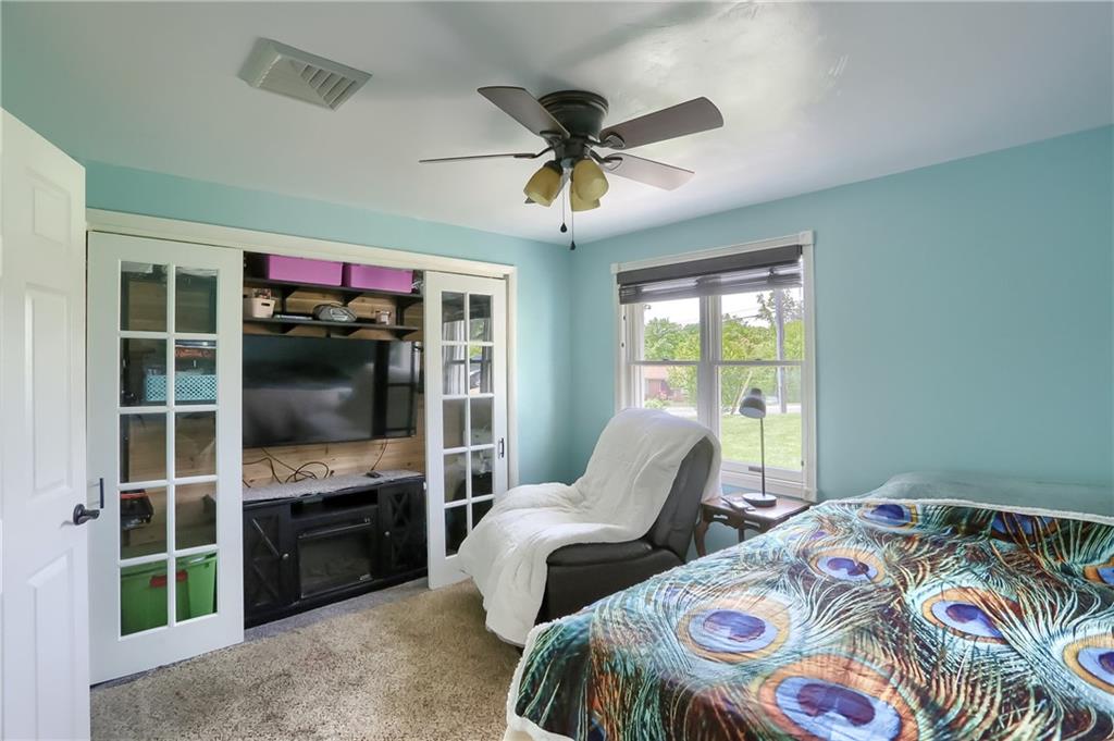 119 Lovi Road Baden, PA 15005 - Photo 17 of 41 a bedroom with bed and a flat tv screen