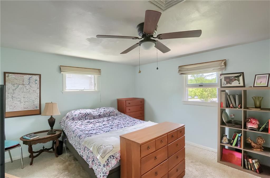 119 Lovi Road Baden, PA 15005 - Photo 19 of 41 a bedroom with a bed and a chandelier