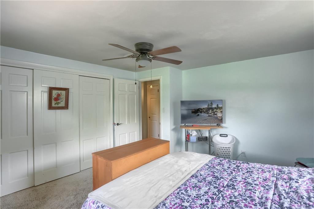 119 Lovi Road Baden, PA 15005 - Photo 20 of 41 a bedroom with a bed and a lamp
