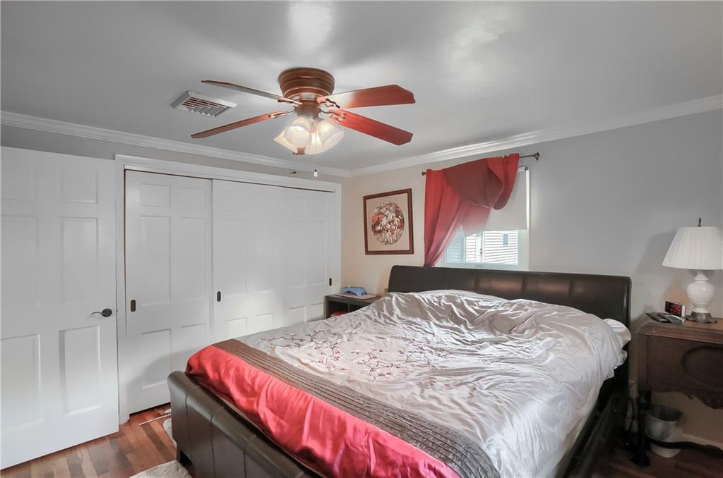 119 Lovi Road Baden, PA 15005 - Photo 22 of 41 a bedroom with a bed and a chandelier