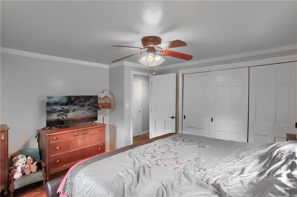 119 Lovi Road Baden, PA 15005 - Photo 23 of 41 a bedroom with a bed and a chandelier
