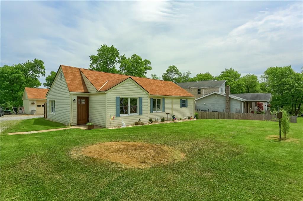 119 Lovi Road Baden, PA 15005 - Photo 29 of 41 a front view of a house with a yard and garage