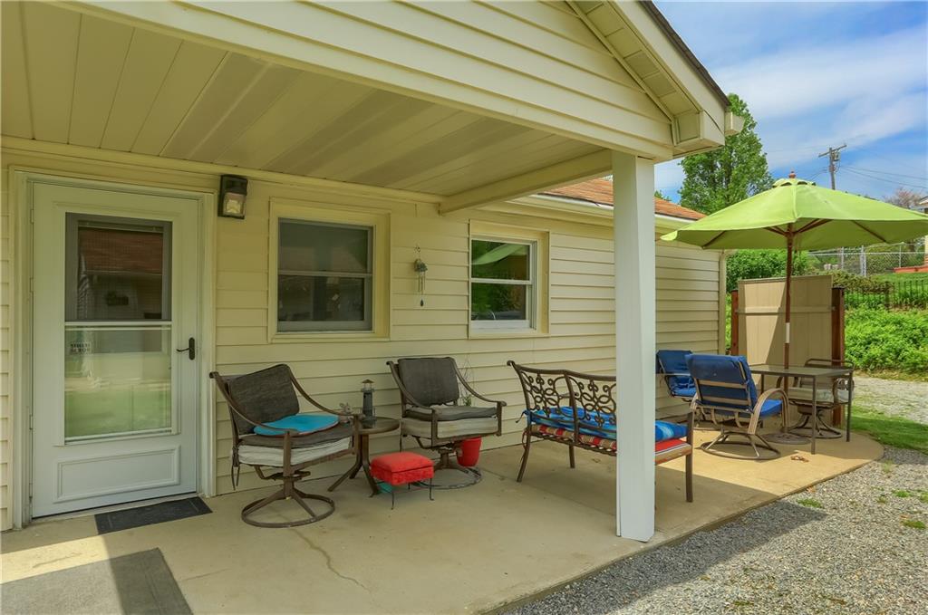 119 Lovi Road Baden, PA 15005 - Photo 35 of 41 a backyard of a house with table and chairs