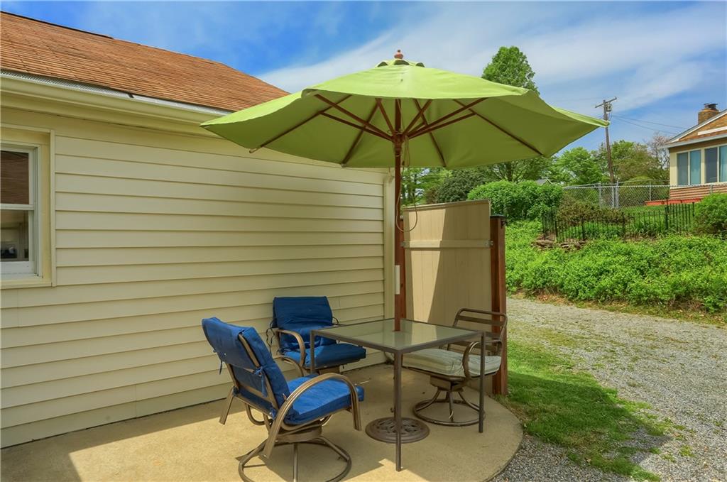 119 Lovi Road Baden, PA 15005 - Photo 36 of 41 a table and chairs in the patio