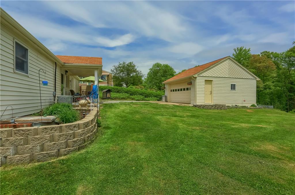 119 Lovi Road Baden, PA 15005 - Photo 38 of 41 a front view of house with yard and green space