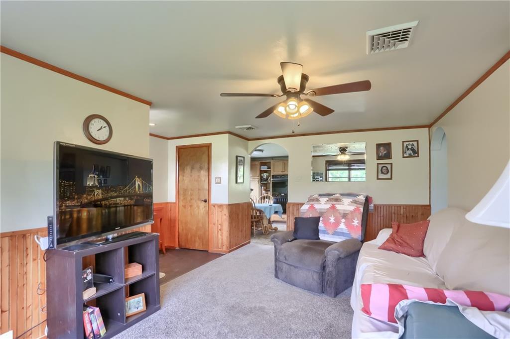 119 Lovi Road Baden, PA 15005 - Photo 6 of 41 a living room with furniture and a flat screen tv