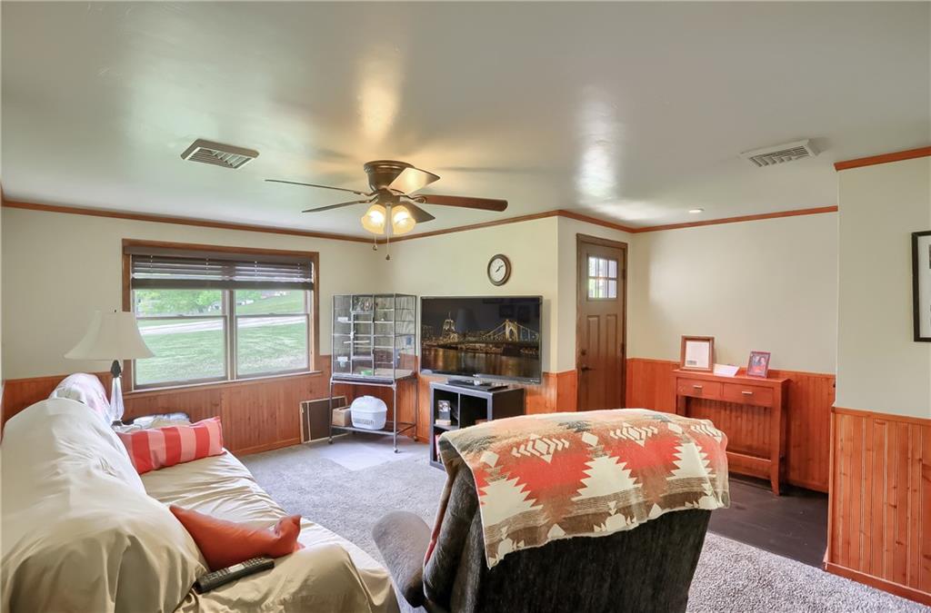 119 Lovi Road Baden, PA 15005 - Photo 7 of 41 a bed room with a bed television and a fireplace