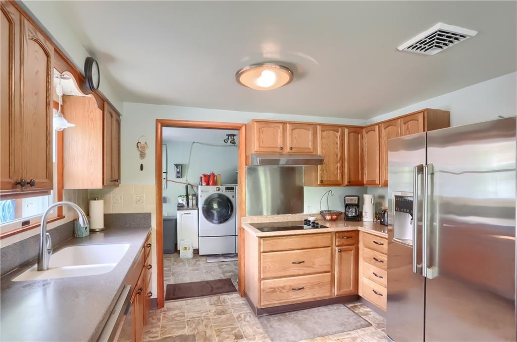 119 Lovi Road Baden, PA 15005 - Photo 10 of 41 a kitchen with a refrigerator and a sink