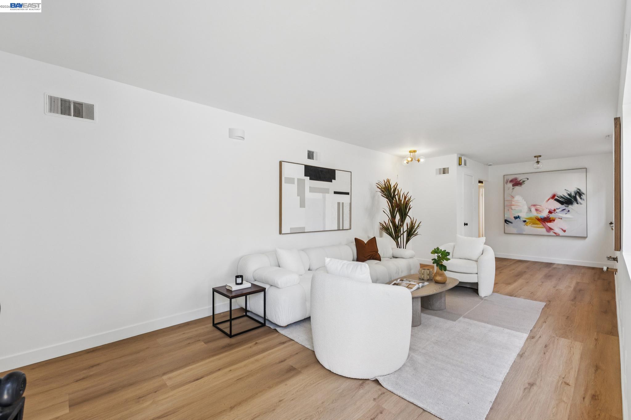 1219 Pearl Street Alameda, CA 94501 - Photo 24 of 40 a living room with furniture and wooden floor