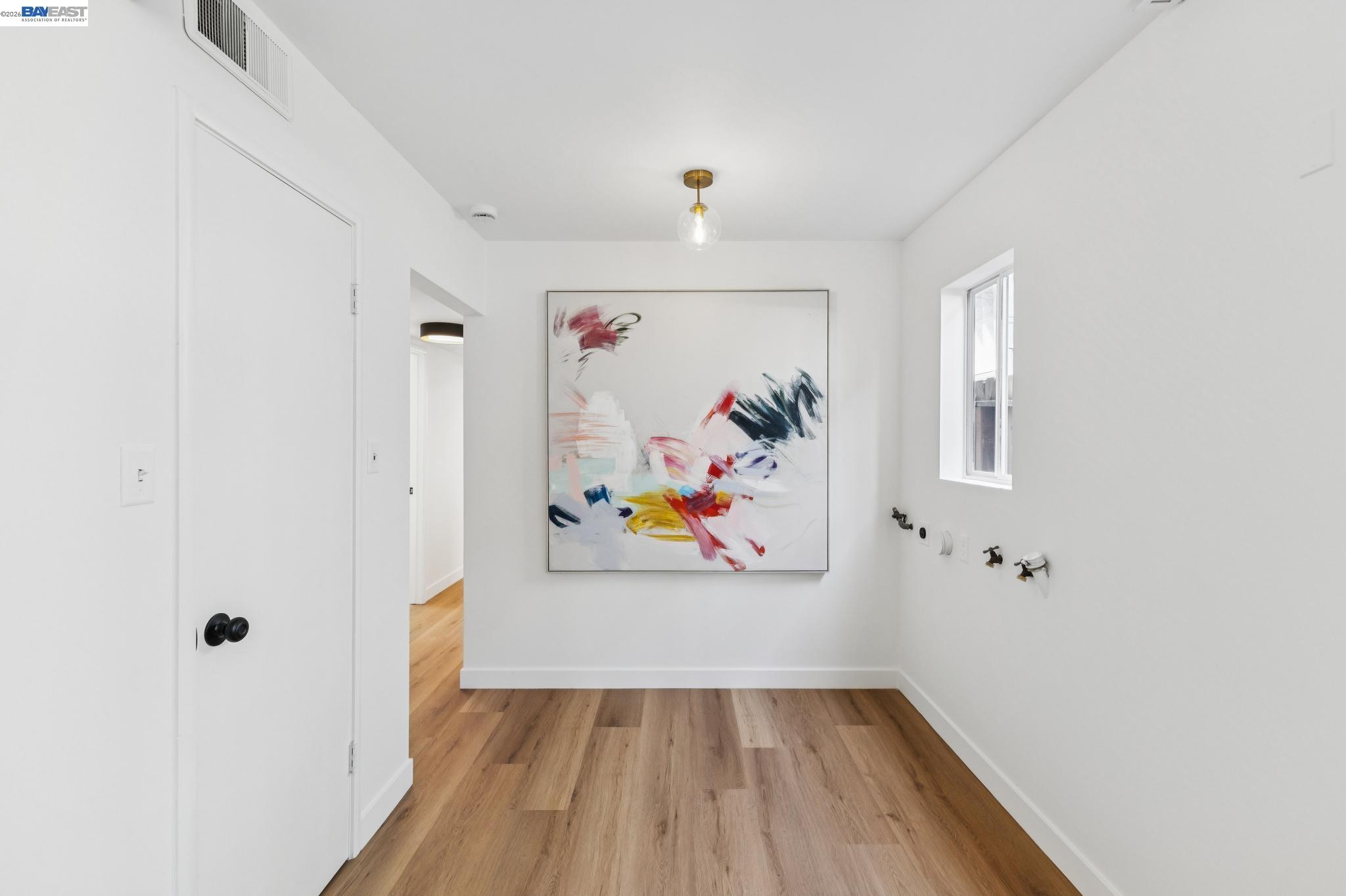 1219 Pearl Street Alameda, CA 94501 - Photo 27 of 40 a view of a hallway with wooden floor and closet