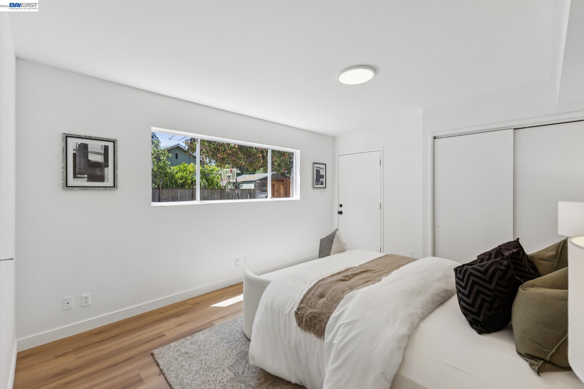 1219 Pearl Street Alameda, CA 94501 - Photo 29 of 40 a bedroom with a bed and a window