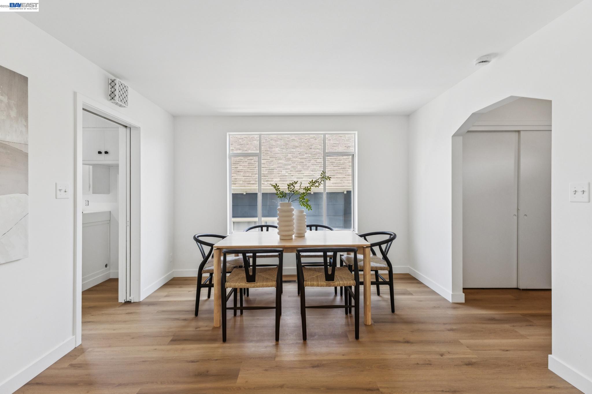1219 Pearl Street Alameda, CA 94501 - Photo 6 of 40 a view of a dining room with furniture window and wooden floor