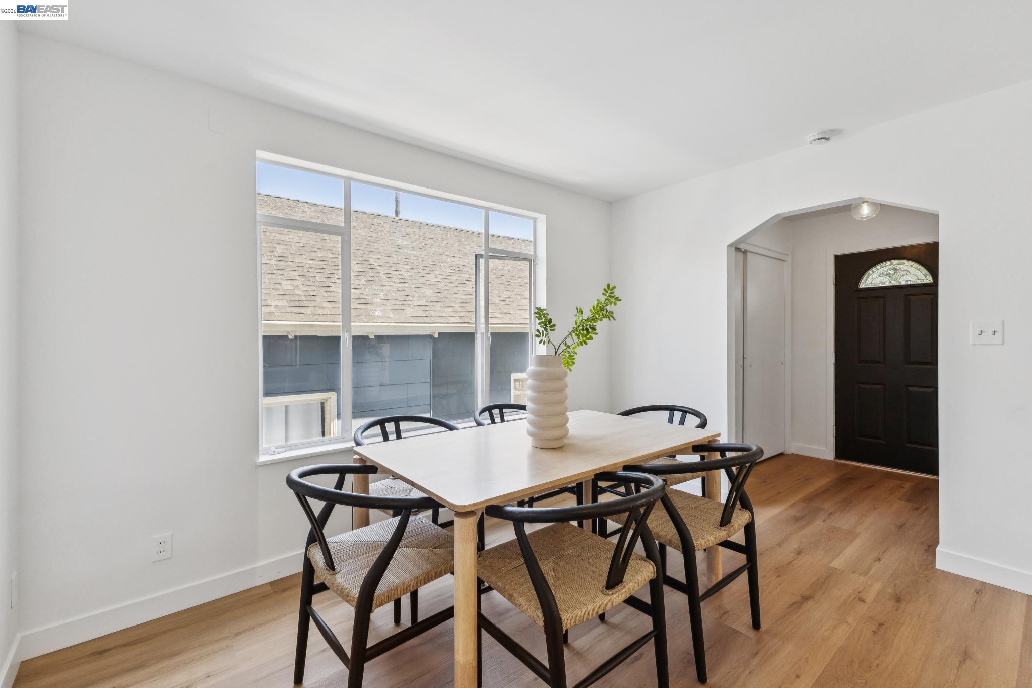 1219 Pearl Street Alameda, CA 94501 - Photo 7 of 40 a view of a dining room with furniture and wooden floor