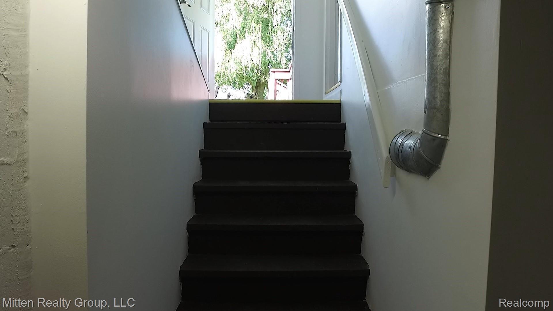 2086 South Elba Road Lapeer, MI 48446 - Photo 41 of 51 25.5 Basement Stairs to Deck