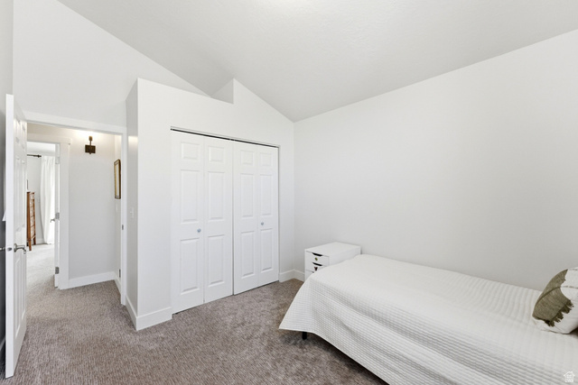 7935 Mustang Loop Road Park City, UT 84098 - Photo 48 of 60 Bedroom featuring light-colored carpeting, white walls, and a vaulted ceiling