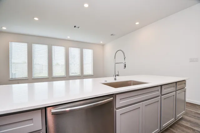 a kitchen with a sink and cabinets