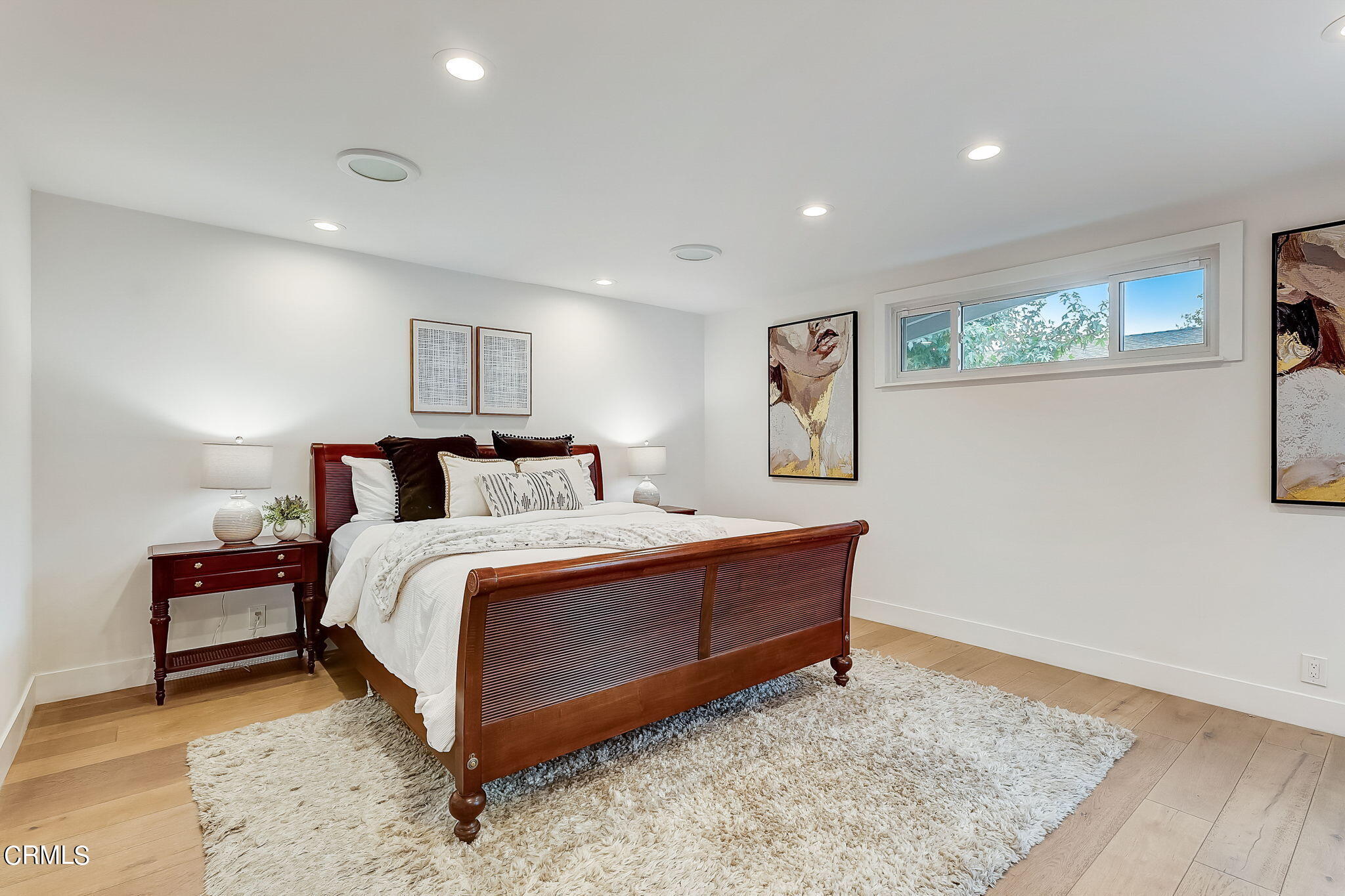 3785 Ranch Top Road Pasadena, CA 91107 - Photo 19 of 39 a spacious bedroom with a bed and a table in it