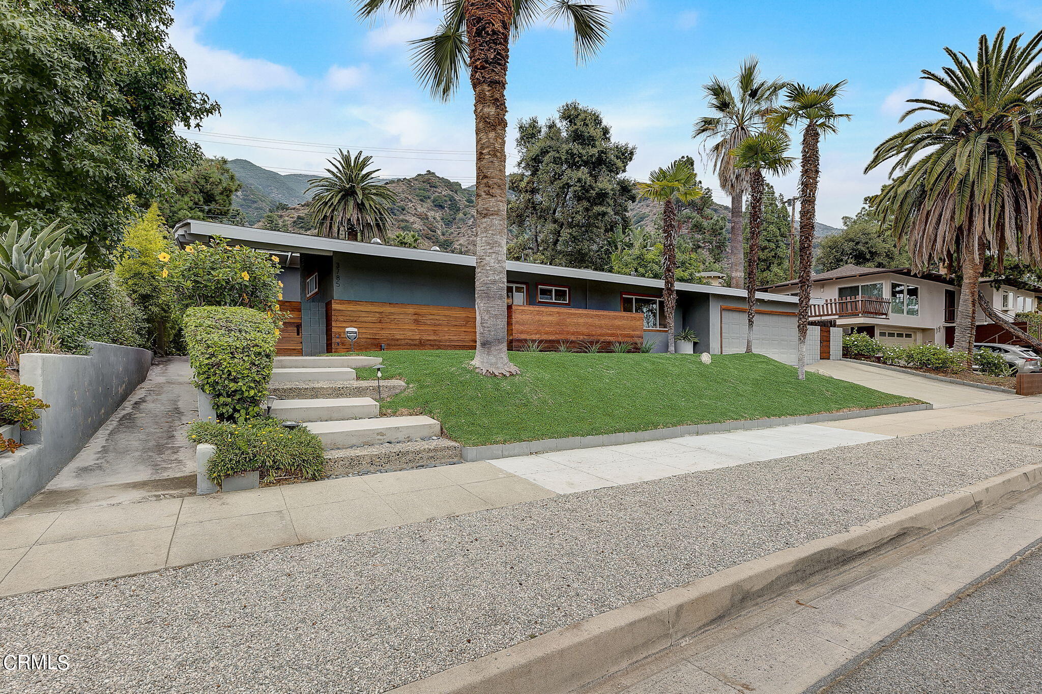 3785 Ranch Top Road Pasadena, CA 91107 - Photo 2 of 39 a view of a backyard with plants and palm tree