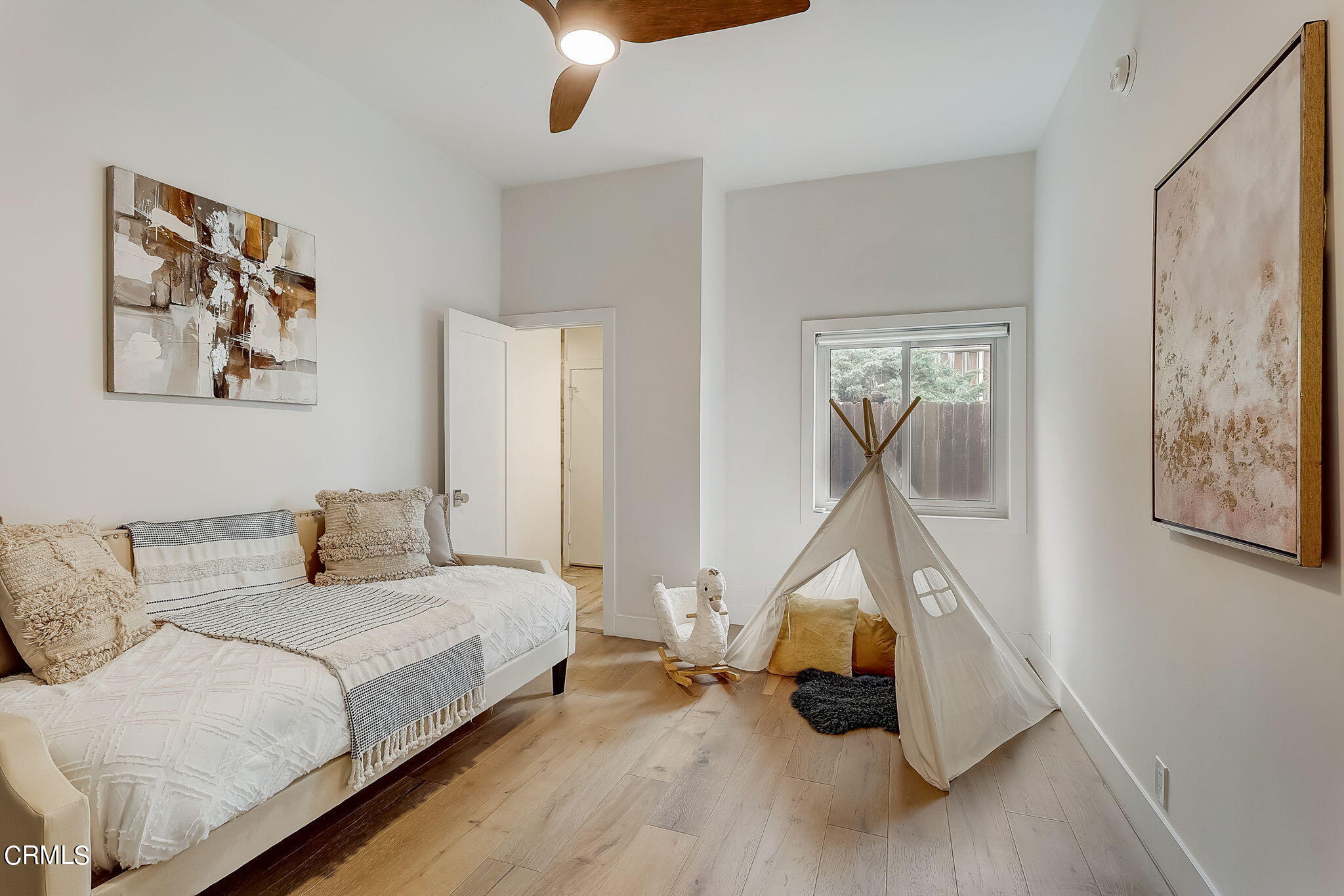 3785 Ranch Top Road Pasadena, CA 91107 - Photo 25 of 39 a bedroom with a bed and a chandelier