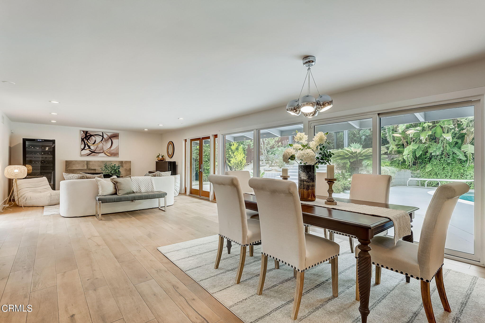 3785 Ranch Top Road Pasadena, CA 91107 - Photo 7 of 39 a dining room with furniture a chandelier and wooden floor
