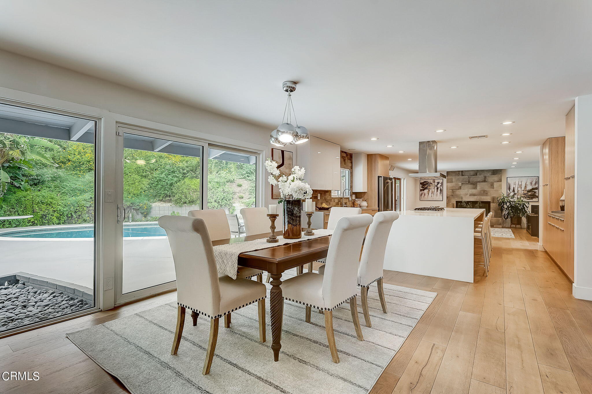 3785 Ranch Top Road Pasadena, CA 91107 - Photo 8 of 39 a dining room with furniture and wooden floor
