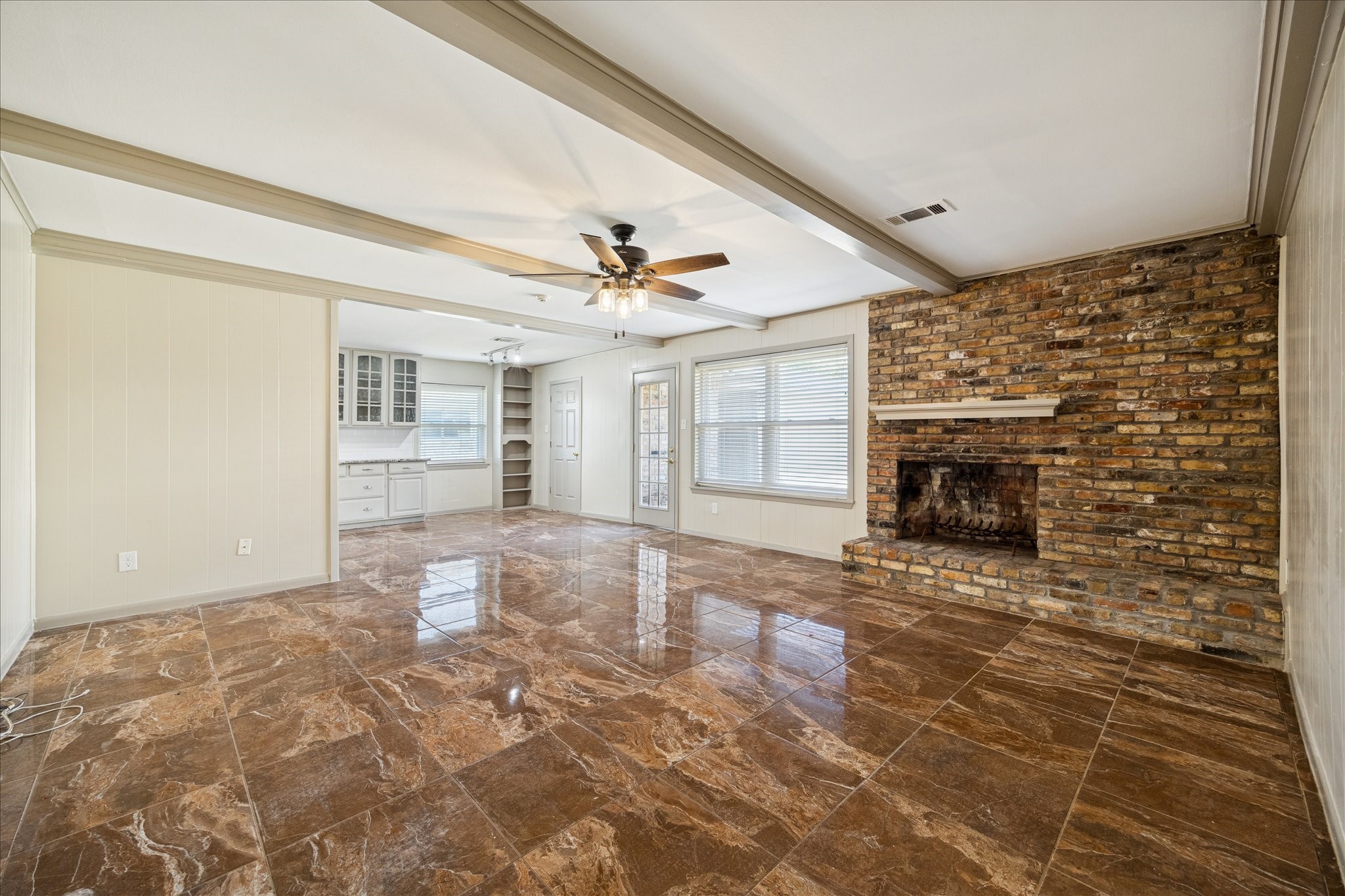 10718 Inwood Drive Houston, TX 77042 - Photo 2 of 20 Picture yourself in this great family room with a cozy fir, perhaps a great movie in television, and easy access to snacks in the nearby kitchen.
