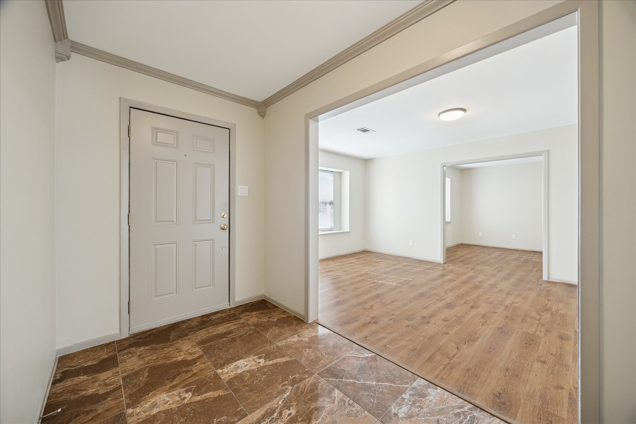 10718 Inwood Drive Houston, TX 77042 - Photo 6 of 20 From the entryway, a look through the formal living area into the dining room. Lovely wood floors will only serve to accent your favorite furnishings.
