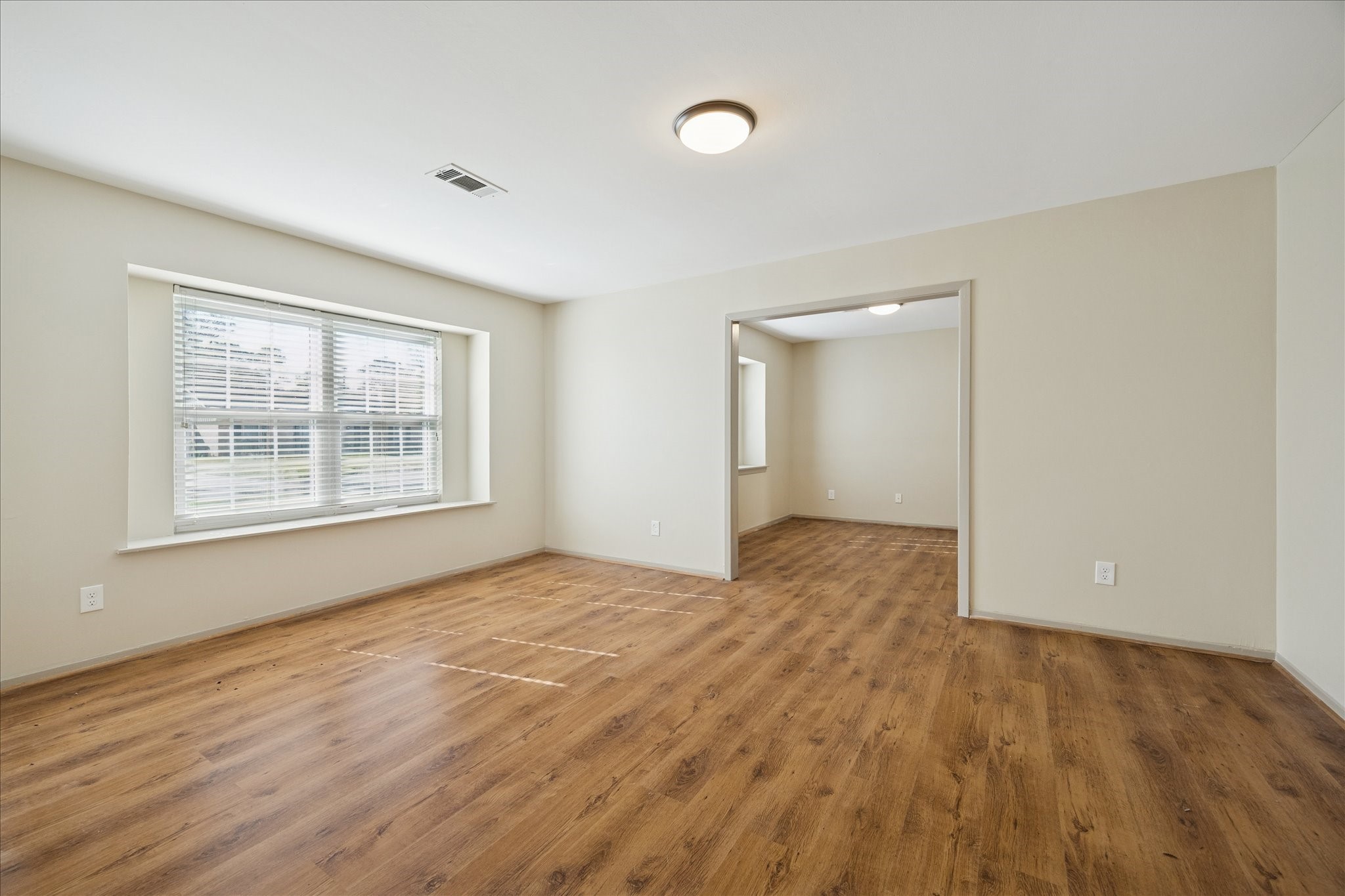 10718 Inwood Drive Houston, TX 77042 - Photo 7 of 20 The well-lit living room offers a great entertaining space, or sometimes just a spot for some quiet reading while enjoying the sunshine.