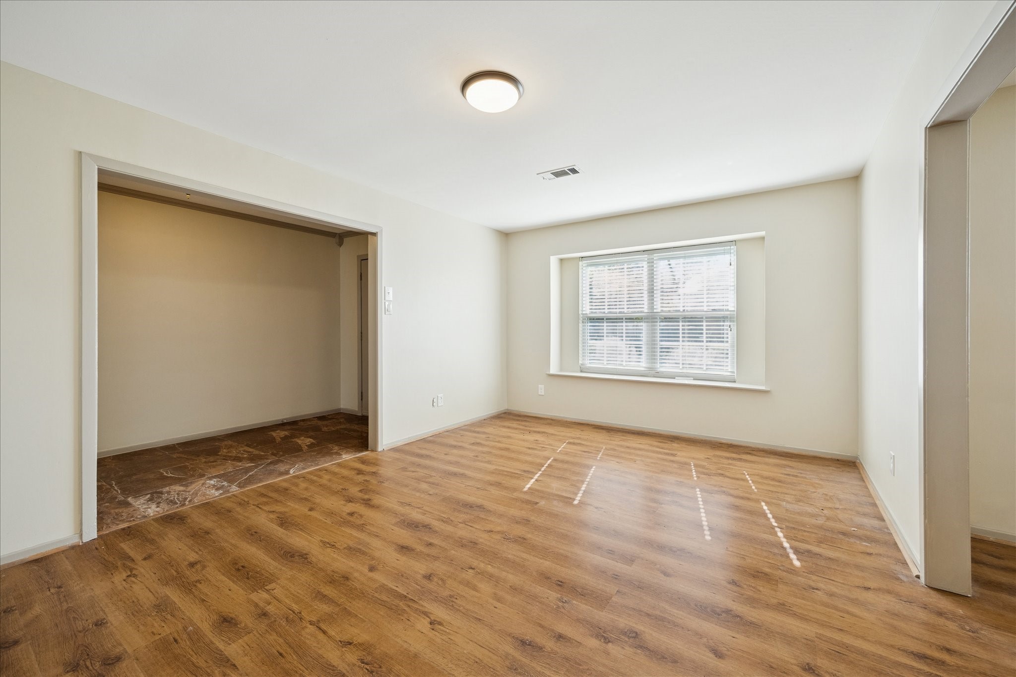 10718 Inwood Drive Houston, TX 77042 - Photo 9 of 20 Another view of the formal living area and the gorgeous wood floors, looking toward the entryway.