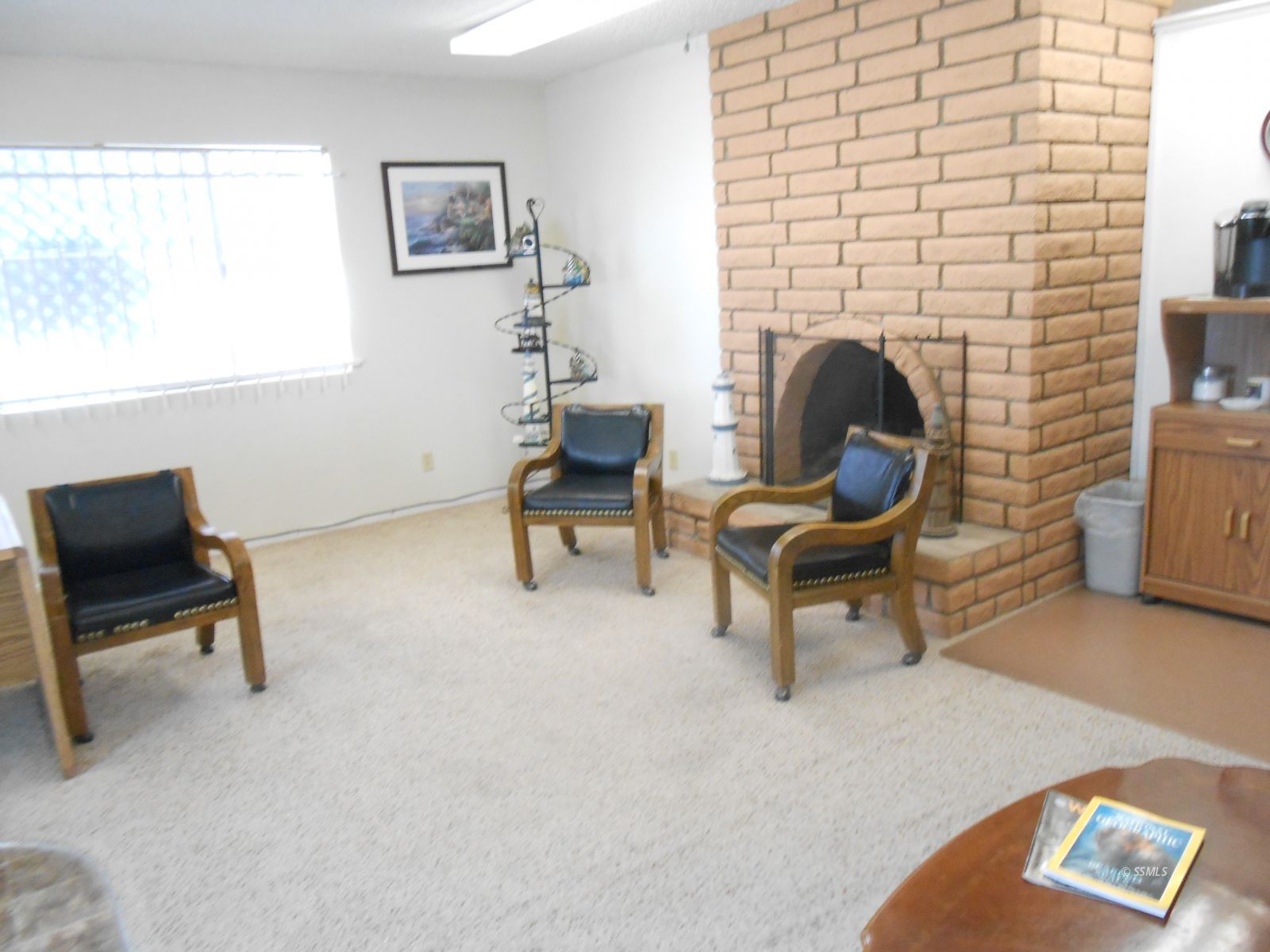 1663 South China Lake Boulevard Ridgecrest, CA 93555 - Photo 2 of 15 a living room with furniture and a fireplace