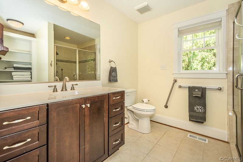 8088 Nelson Ridge Drive Hanover, VA 23069 - Photo 21 of 50 a spacious bathroom with a toilet sink and mirror