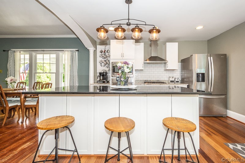 8088 Nelson Ridge Drive Hanover, VA 23069 - Photo 34 of 50 a kitchen with stainless steel appliances a dining table chairs and a large window