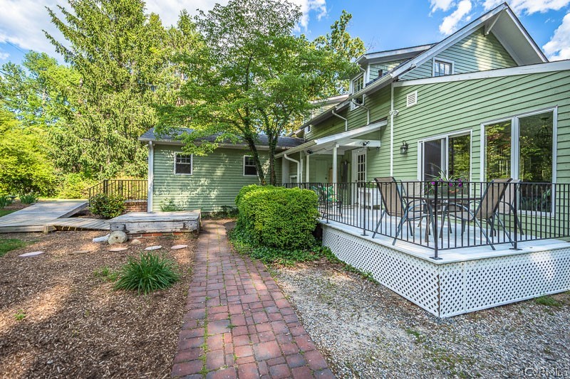 8088 Nelson Ridge Drive Hanover, VA 23069 - Photo 47 of 50 a view of a house with a yard and plants
