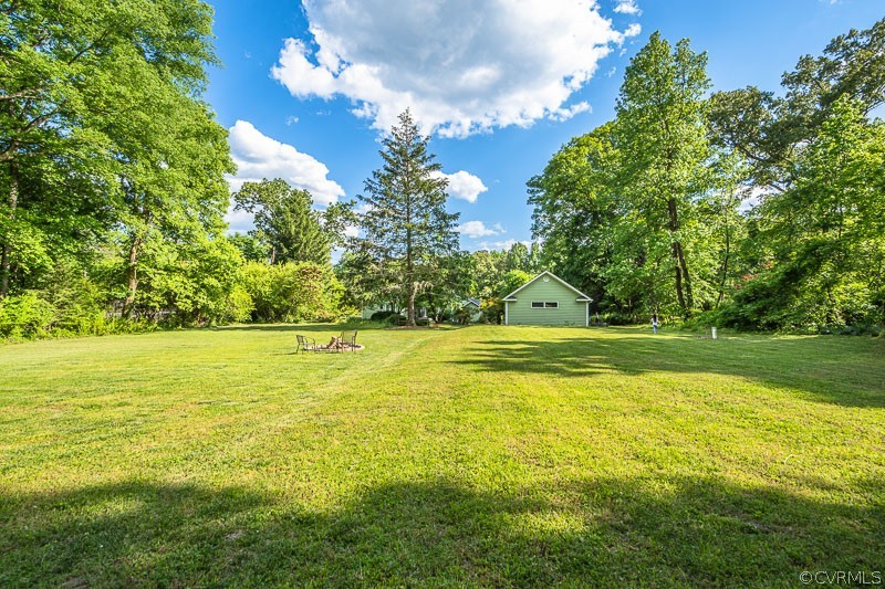 8088 Nelson Ridge Drive Hanover, VA 23069 - Photo 50 of 50 a view of a swimming pool with an outdoor space and seating area