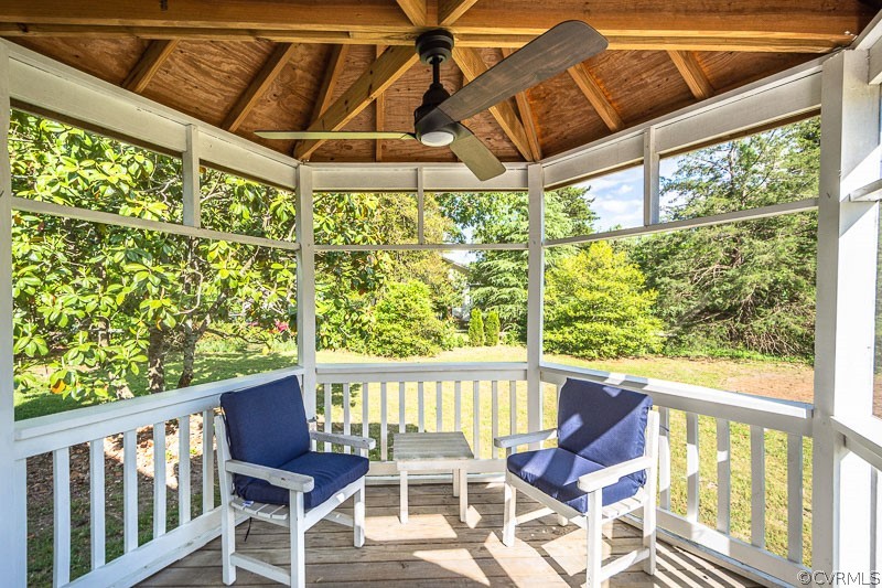 8088 Nelson Ridge Drive Hanover, VA 23069 - Photo 7 of 50 a view of a chair and table in the glass deck
