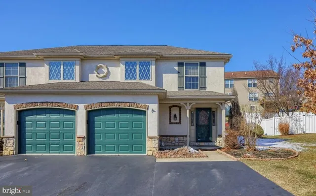 a front view of a house with a garage