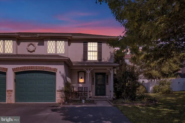 a front view of a house with yard