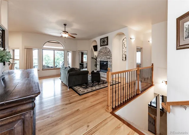 a view of a livingroom with furniture and a kitchen view