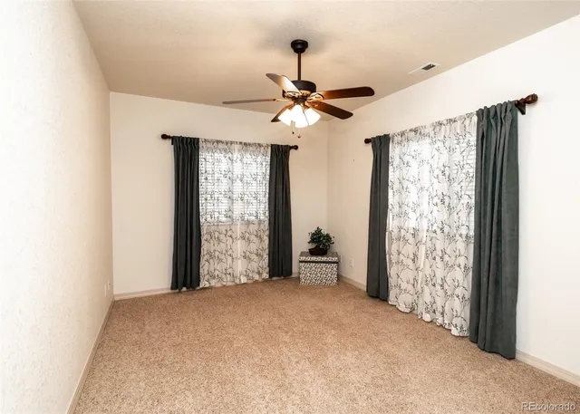 a view of entryway with window ceiling fan