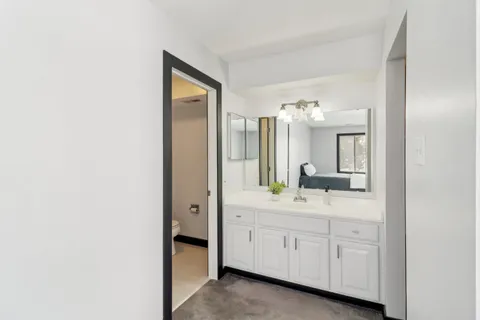 a bathroom with a sink and mirror