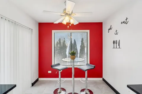 a view of a room with a chandelier furniture and window