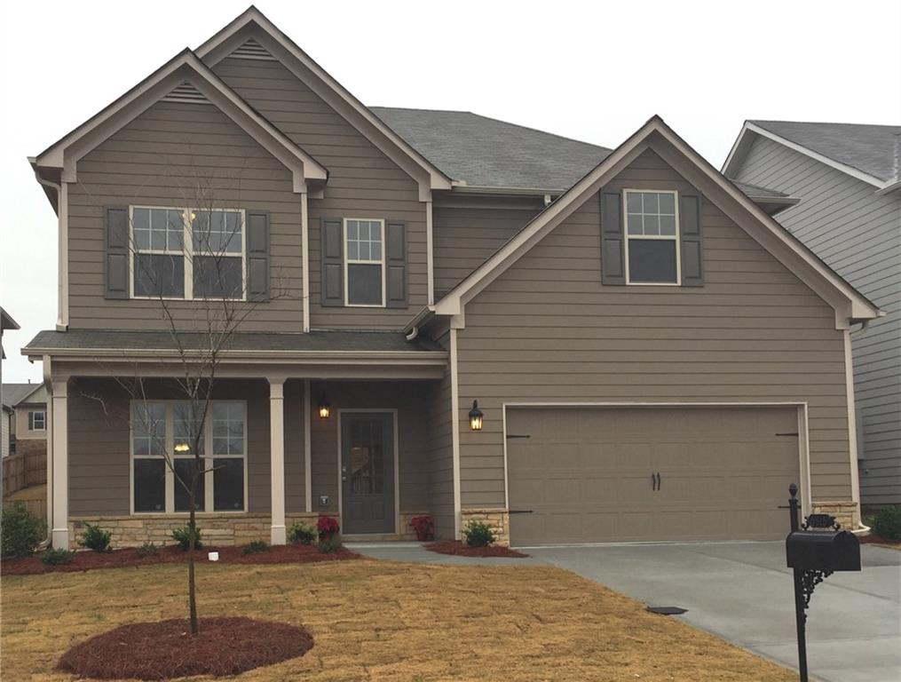 5575 Rialto Way Cumming, GA 30040 - Photo 1 of 1 a front view of a house with a garage