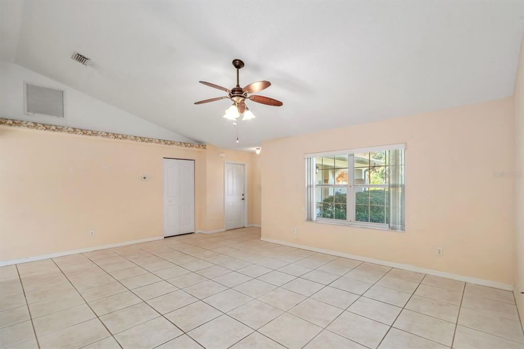 10795 Southwest 53rd Circle Ocala, FL 34476 - Photo 12 of 47 a view of an empty room with a window