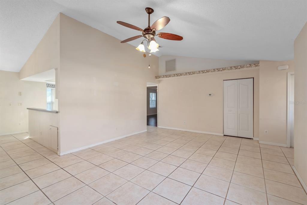 10795 Southwest 53rd Circle Ocala, FL 34476 - Photo 13 of 47 a view of an empty room and chandelier fan