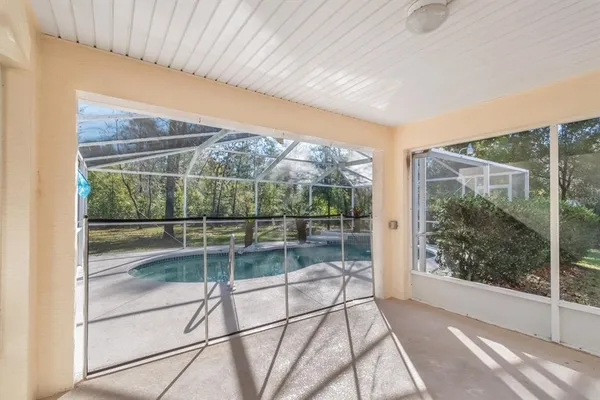 a view of a room with a glass door