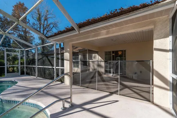 a view of a chairs and table in the patio