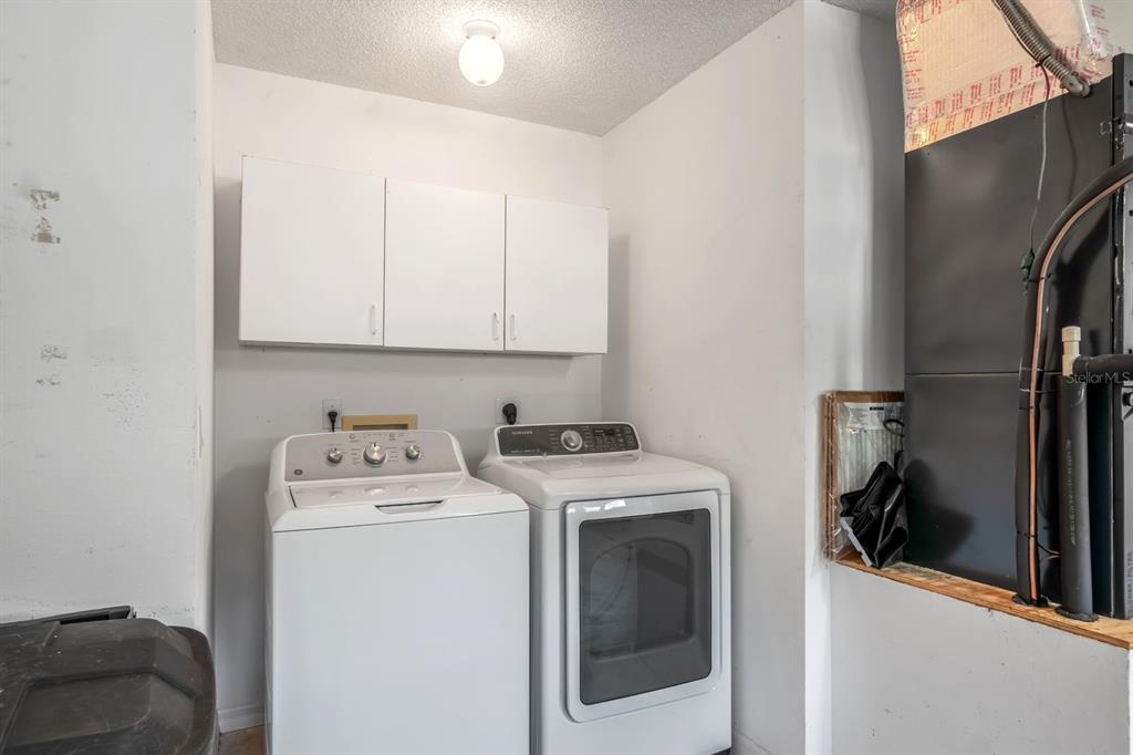 10795 Southwest 53rd Circle Ocala, FL 34476 - Photo 41 of 47 a utility room with dryer and washer