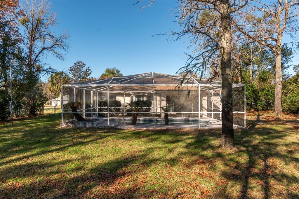 10795 Southwest 53rd Circle Ocala, FL 34476 - Photo 45 of 47 a view of a house with swimming pool
