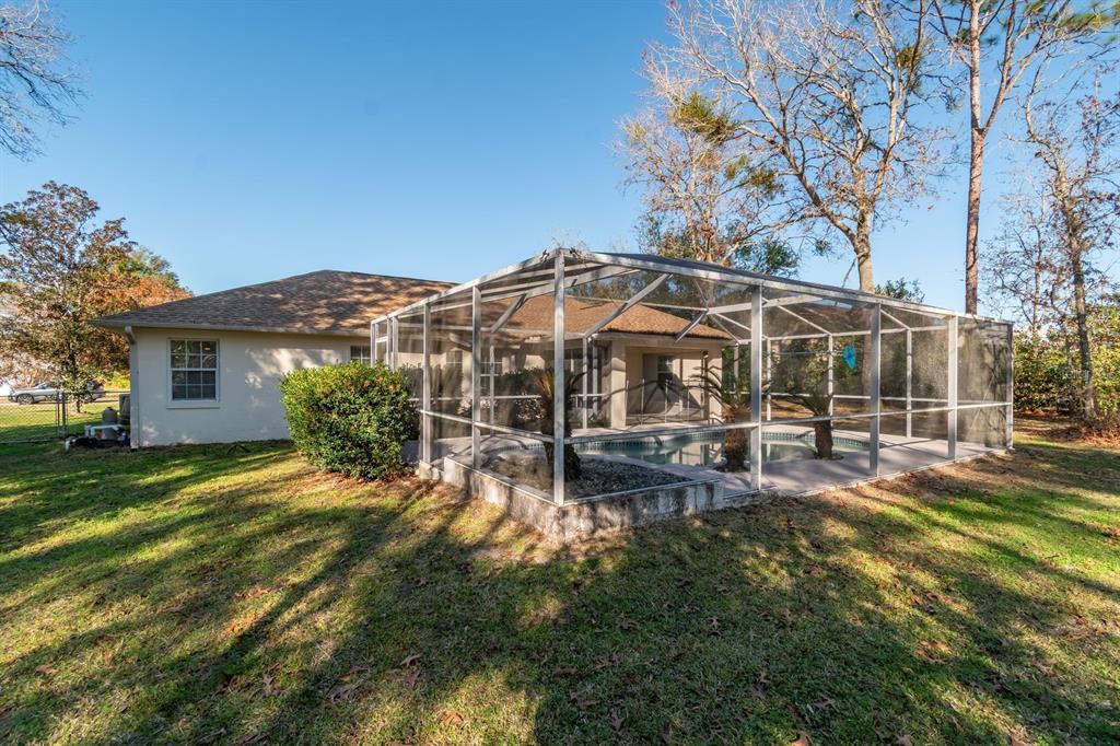 10795 Southwest 53rd Circle Ocala, FL 34476 - Photo 46 of 47 a view of a house with backyard porch and sitting area