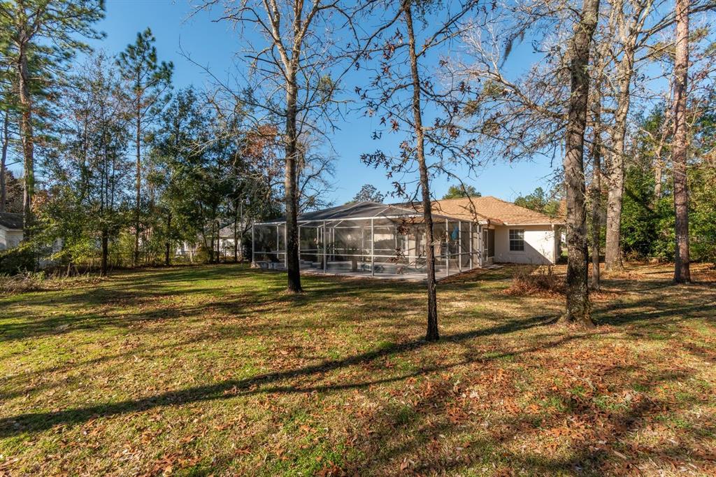10795 Southwest 53rd Circle Ocala, FL 34476 - Photo 47 of 47 a view of a yard with wooden fence
